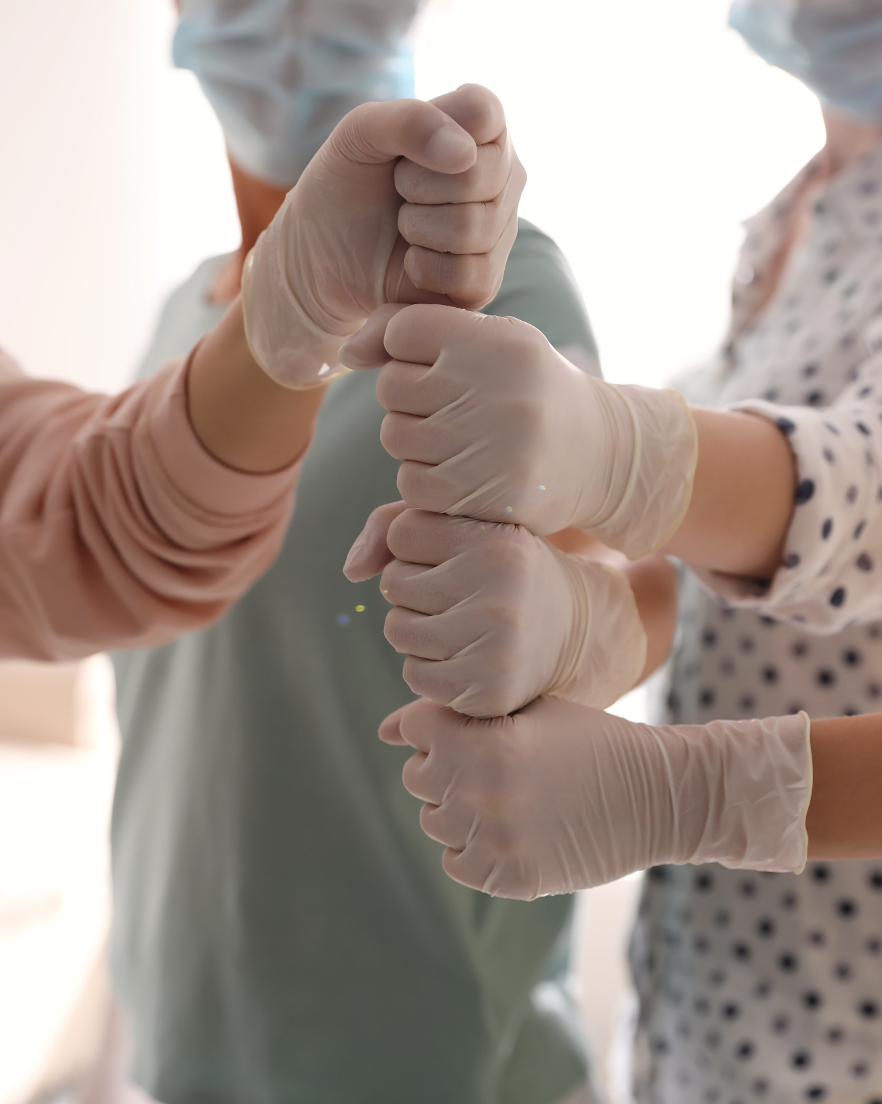 Gloved hands in surgery